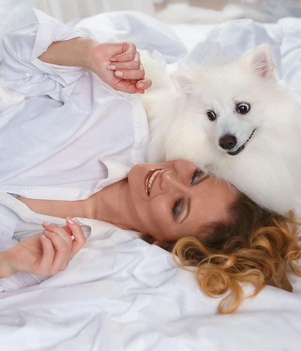 Woman performing light morning exercises in a bright room